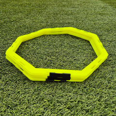 Yellow hex training disc on grass